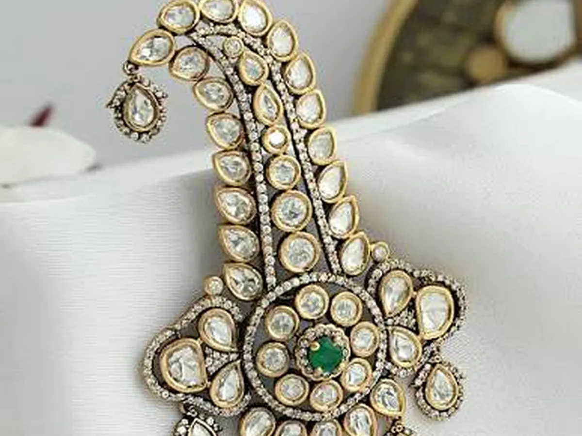 Close-up of a premium stone-set groom accessory