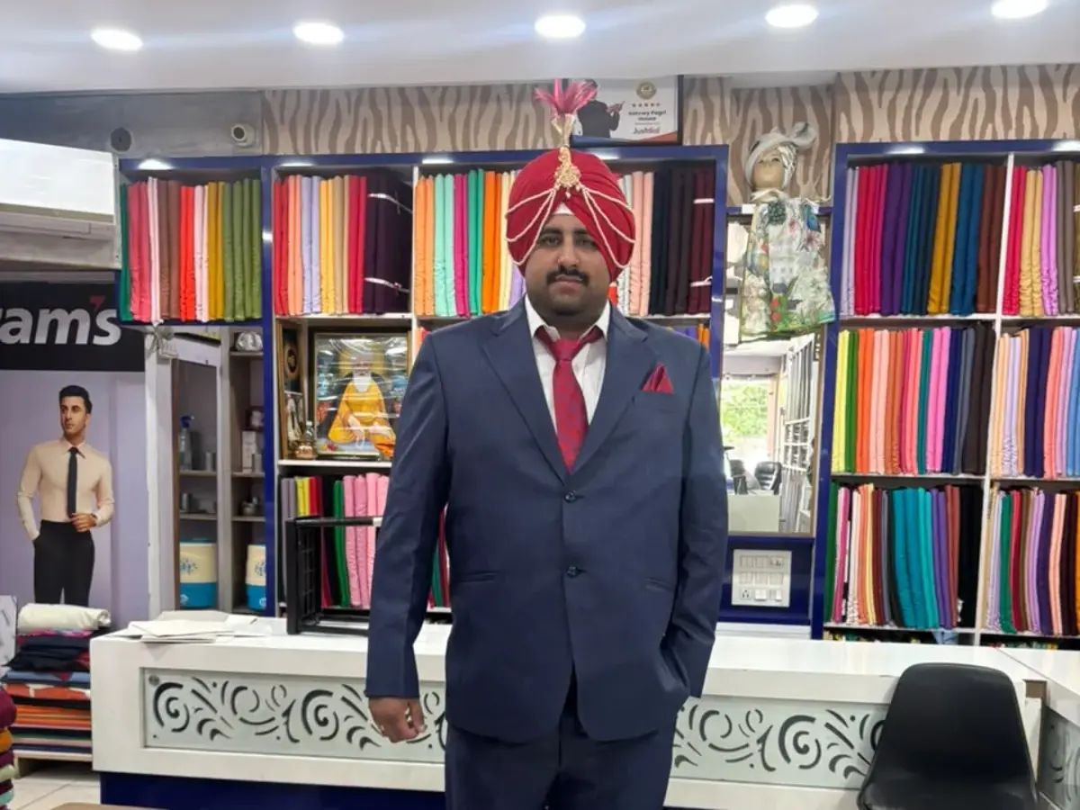 Customer wearing a royal red wedding pagri