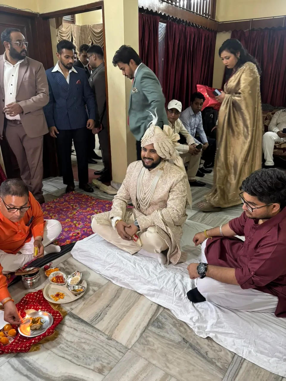 Groom in an ivory pagri during a traditional wedding ceremony